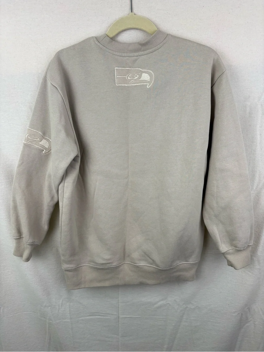 NFL unisex Crewneck Sweatshirt in Light Taupe with Embroidered Logo